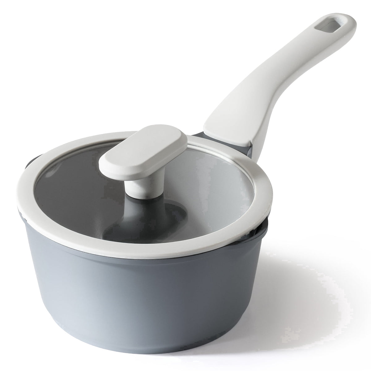 Gray saucepan with a light gray handle and a clear lid.