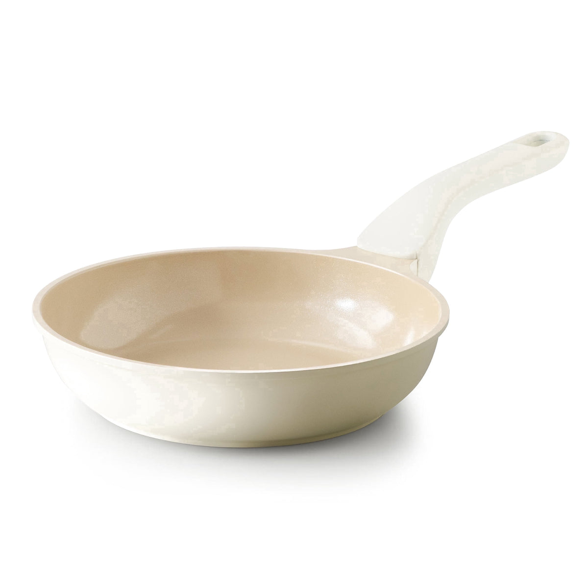 Cream frying pan with a pale handle and light-colored interior.