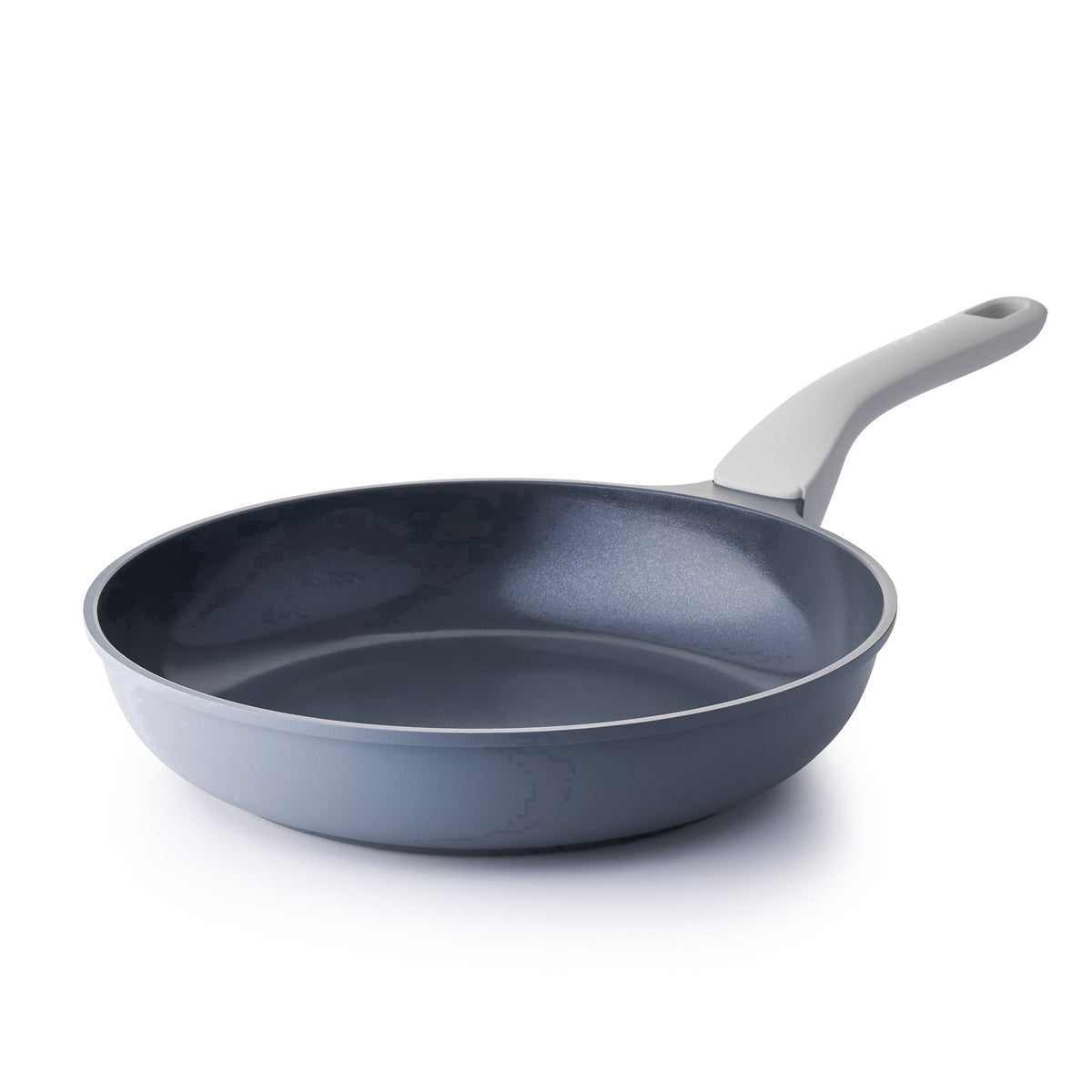 Gray frying pan with a light gray long handle and dark interior.