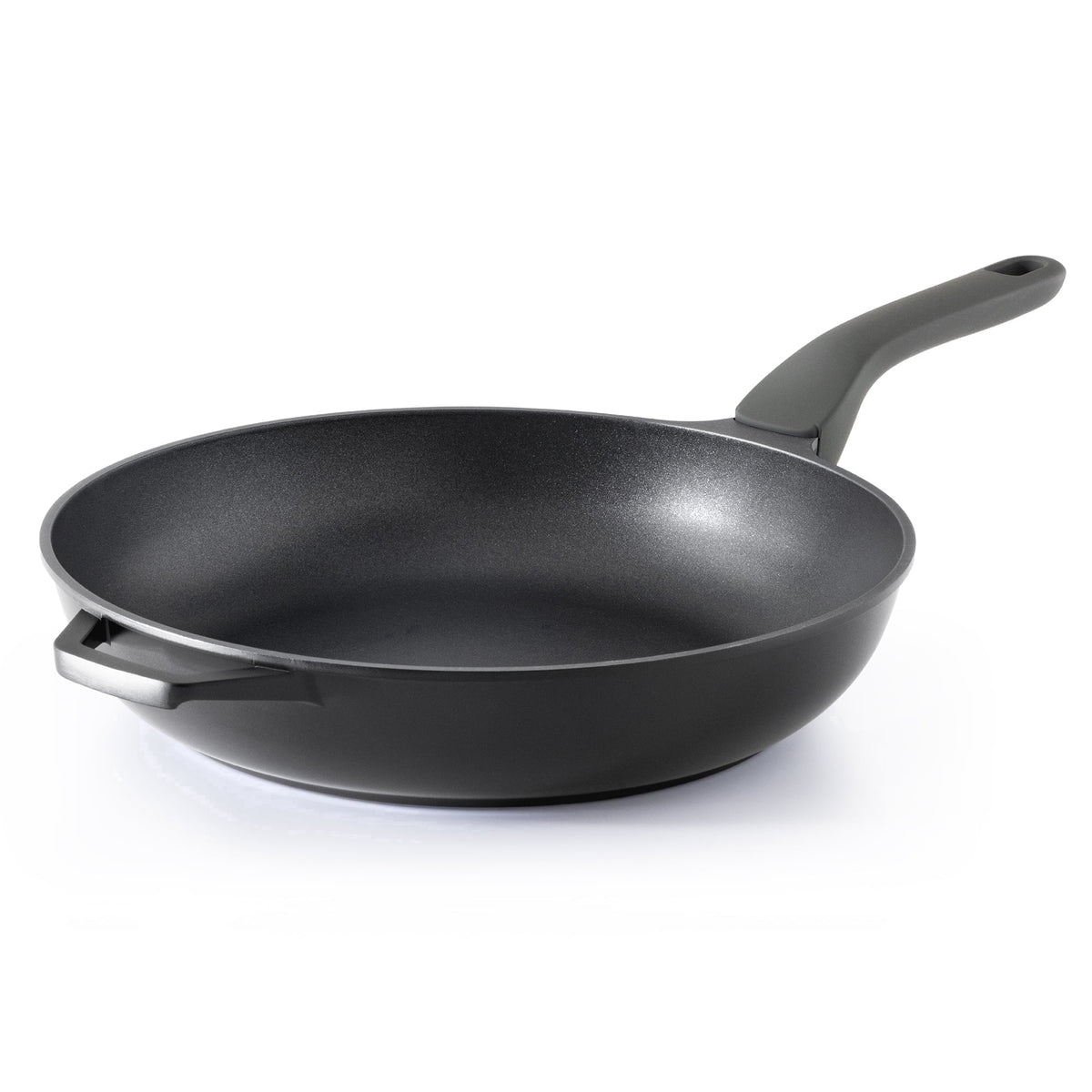 Black frying pan with a dark long handle and a helper handle.