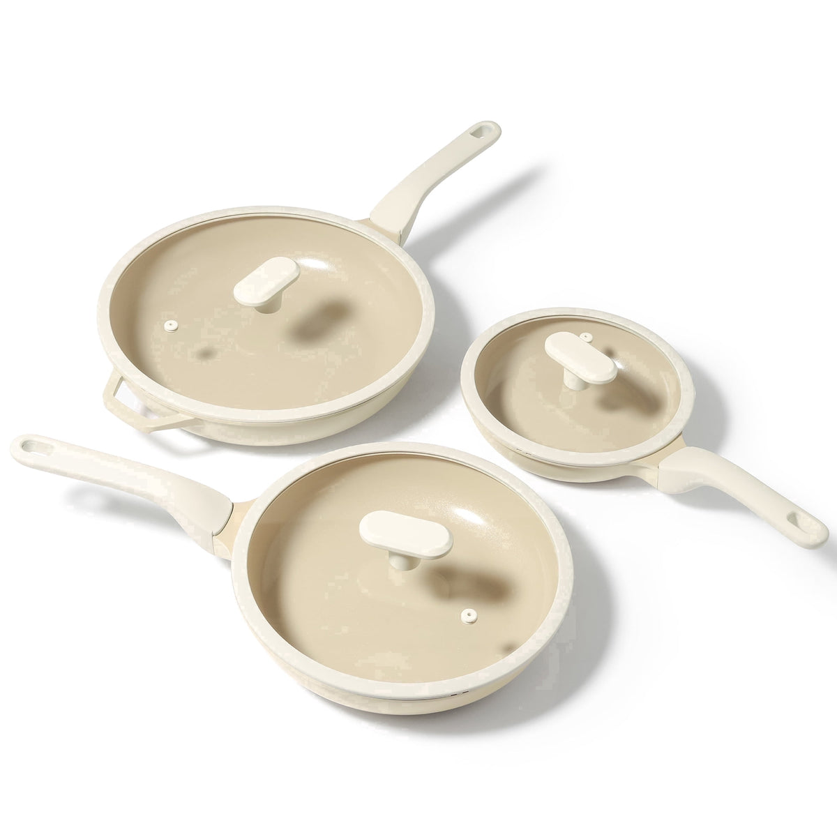 Ivory three frying pans with three lids.